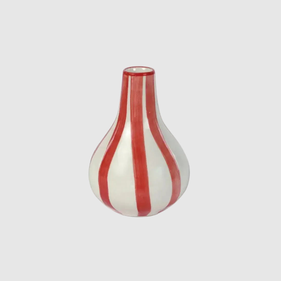 Vase with red and white stripes on a white background