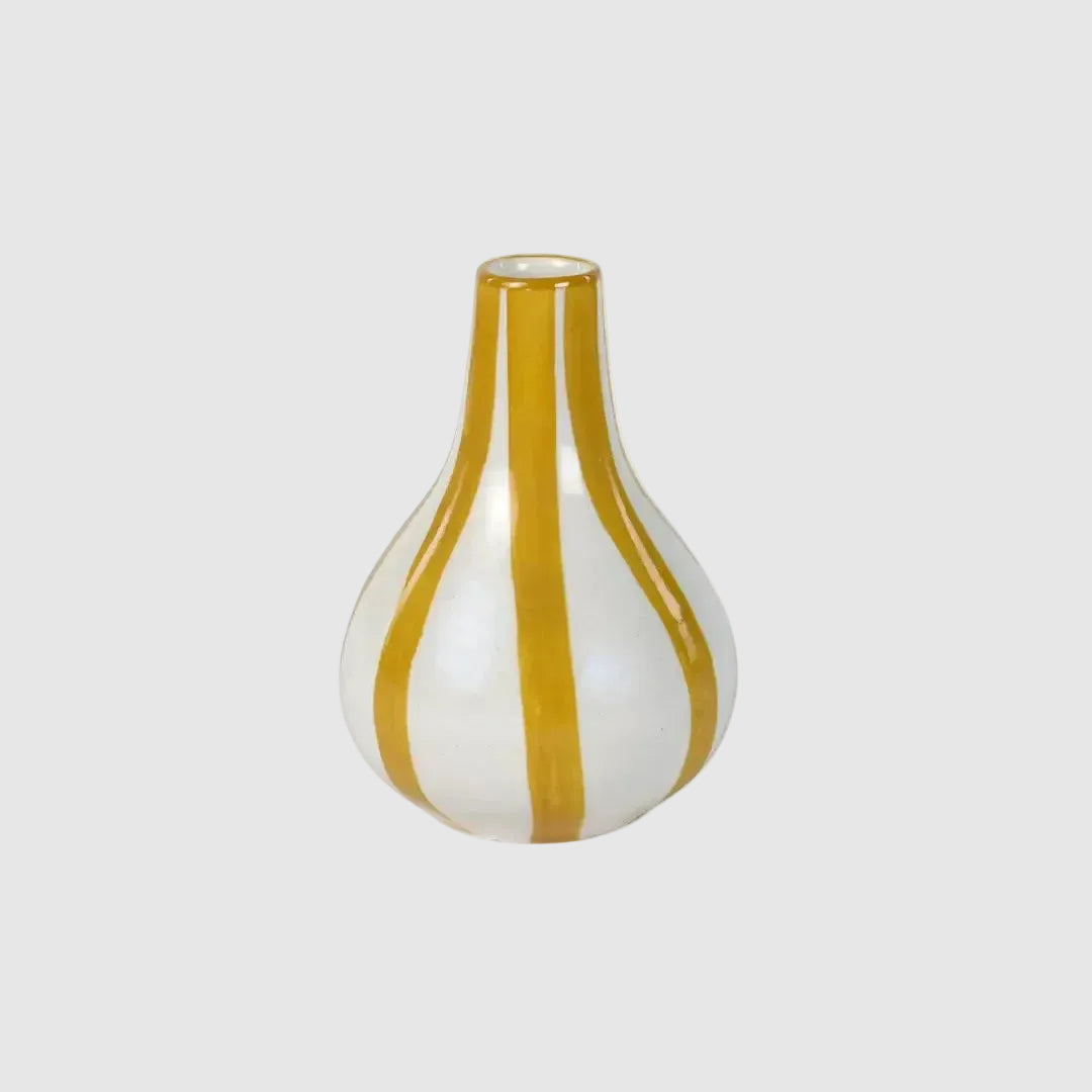 Vase with yellow and white stripes on a white background